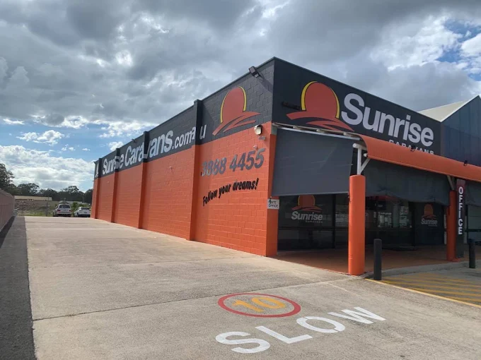 Sunrise Caravans dealership corner showing our phone number 3888 4455