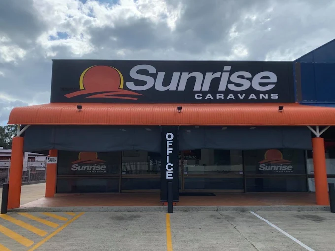 Sunrise Caravans office entrance with orange awning at 290 Eastern Service Rd, Burpengary